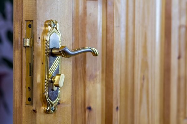 Vintage door handle on wooden doors close-up